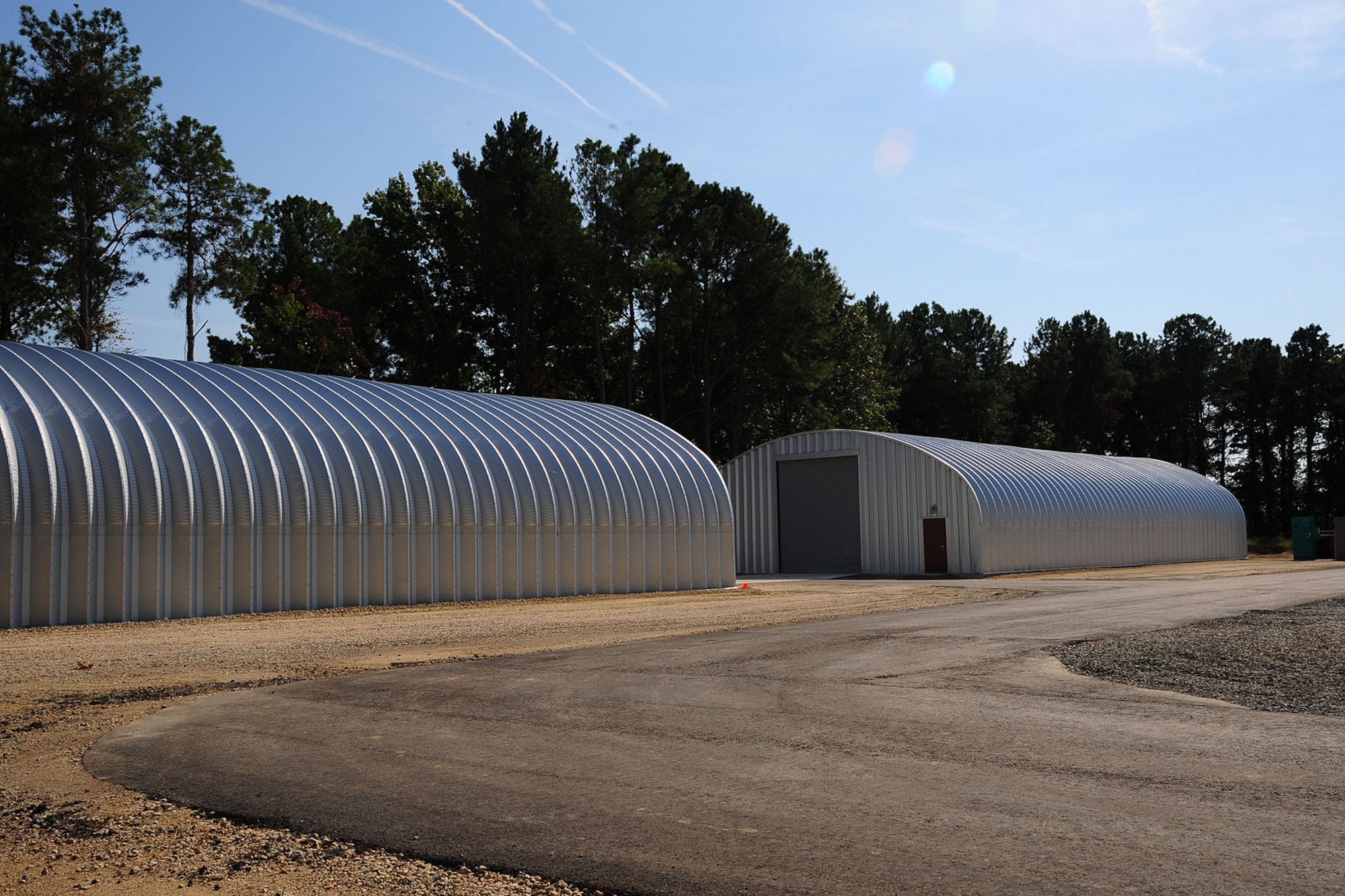 U.S. Air Force Rapid Engineer Deployable Heavy Operational Repair Squadron Engineers from various bases completed the pre-engineered buildings at Langley Air Force Base, Va. The RED HORSE members worked for nearly six months at Raptor Town, building male and female latrines, pre-engineered buildings and paved roads, which cost an estimated $600,000 to complete. (U.S. Air Force photo by Staff Sgt. Ashley Hawkins/Released)