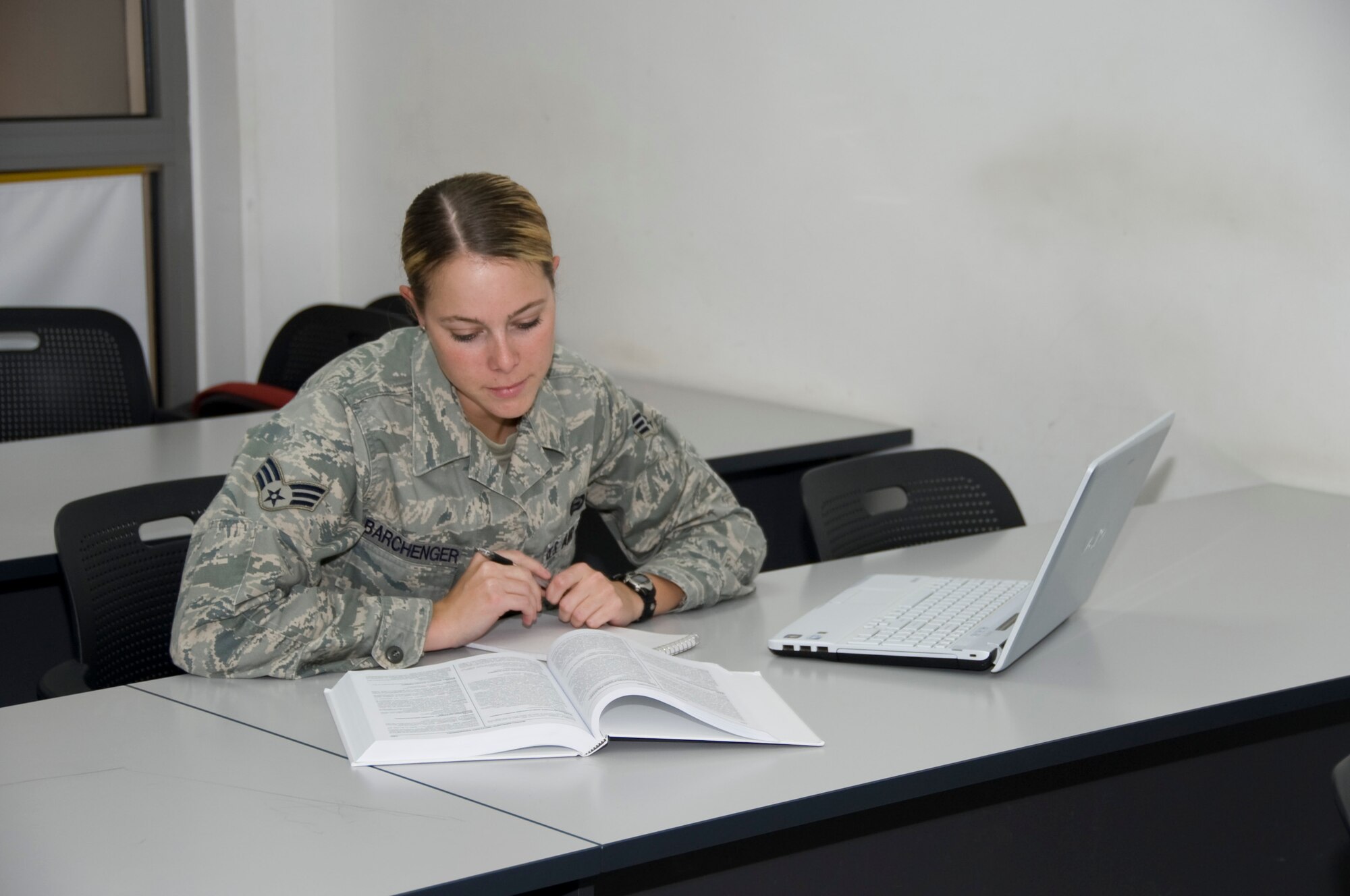 Senior Airman Emily Barchenger, 37th Expeditionary Bomb Squadron intelligence analyst, studies for an upcoming exam at the BPC Education center Sept. 27, 2012. Barchenger recently became the 400,000 Airman to complete at Community College of the Air Force degree. She obtained an Associate Degree of Science in Intelligence Studies and Technology. Barchenger is deployed from  Ellsworth Air Force Base, S.D. (U.S. Air Force photo/Senior Airman Bryan Swink)