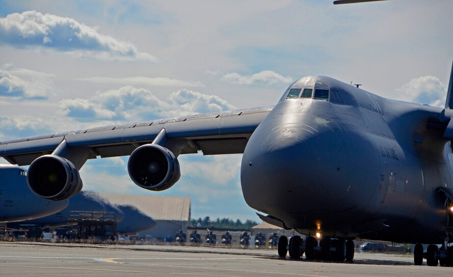 A C-5B Galaxy, assigned to the 439th Airlift Wing at Westover Air Reserve Base, taxies from the flight line for a local training mission. The 439th regularly deploys USAF's largest aircraft worldwide. The massive C-5's unmatched airlift capability brings outsize cargo to any point on the globe. Westover's aerial port reservists continue to be deployed throughout this year to Bagram Air Base, Afghanistan -- one of the world's largest overseas bases. (US Air Force photo/Master Sgt. Andrew Biscoe)