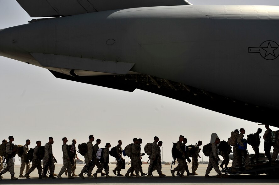 U.S. Marines board an Air Force C-17 Globemaster III during a redeployment mission at Camp Bastion Airfield, Afghanistan, Sept. 11, 2012. The Afghan National Security Forces and U.S. forces have worked closely and effectively to transition control of security in Afghanistan. 
(U.S. Air Force photo/Staff Sgt. Clay Lancaster/ Released) 