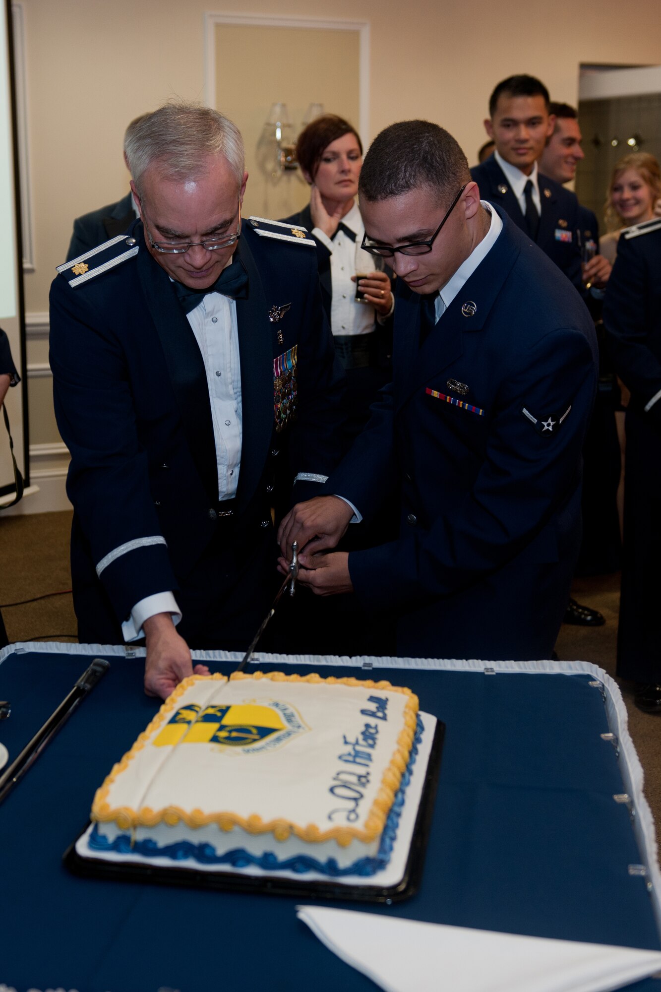 RAF ALCONBURY, United Kingdom – Maj. Jason Nafts, 423rd Medical Squadron, and Airman Steven Hyman, 423rd Communication Squadron, cut the Air Force’s birthday cake during the 501st Combat Support Wing Air Force Ball at the Stukeley Inn on RAF Alconbury Sept. 21. More than 300 Airmen attended the ball celebrating the 65th birthday of the U.S. Air Force. Brig. Gen. John Quintas, the Defense Attaché at the U.S. Embassy in London, was the guest speaker for the ball and reflected on the Air Force’s past and talked about how the Airmen are the strength of the future (U.S. Air Force photo by Staff Sgt. Brian Stives)