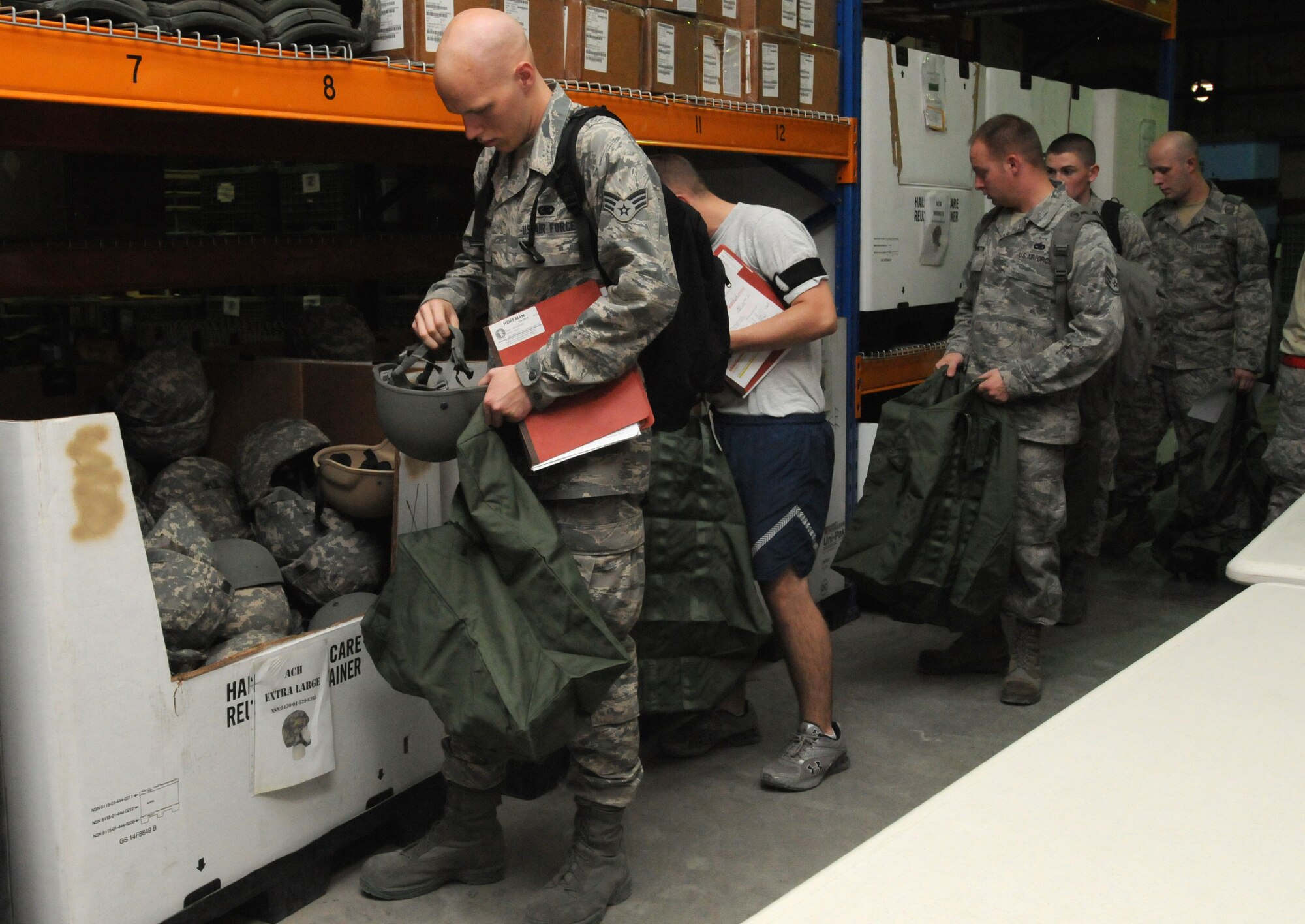 SOUTHWEST ASIA - U.S. Air Force Airmen inprocessing from Royal Air Force Lakenheath, England, pick up their individual protective equipment Sept. 22, 2012. Airmen deploying to the 380th Air Expeditionary Wing are issued IPE by the 380th Expeditionary Logistics Readiness Squadron’s IPE section within three days of arrival. (U.S. Air Force photo/Tech. Sgt. Amanda Savannah)