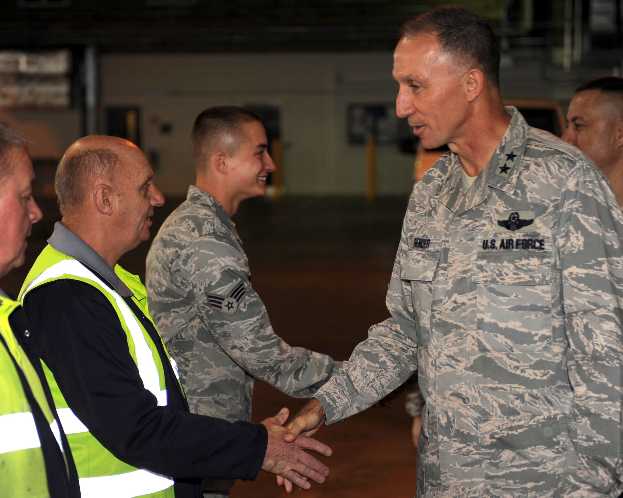 Maj. Gen. William Bender, Expeditionary Center commander shakes hands with Ministry of Defense employee, Robert “Nobby” Spencer, here, Sept. 27, 2012. The general visited the 727th AMS as a part of a visit to England to more effectively utilize the assets that he commands. (U.S. Air Force photo/ 2nd Lt. Christopher Mesnard)