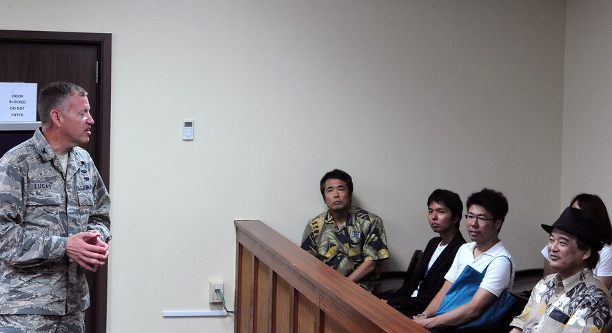 U.S. Air Force Col. Edward Lucas, 18th Wing Judge Advocate staff judge advocate, speaks with students from the University of Ryukyus Graduate School of Law, who visited Kadena Air Base, Japan, Sept. 27, 2012. The students visited the base to get a better understanding of International Law, Japan-U.S. Status of Forces Agreement and criminal justice from a military court system. (U.S. Air Force photo/Airman 1st Class Justin Veazie)
