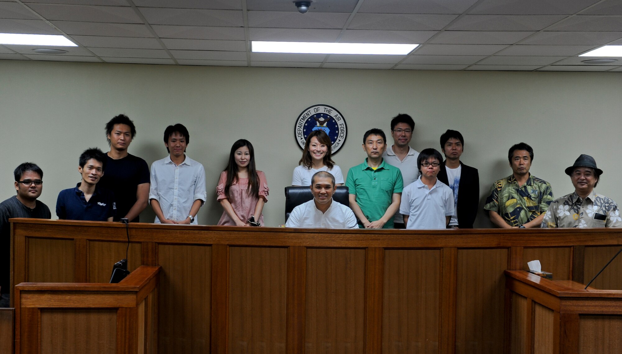 Students from the University of Ryukyu's Graduate School of Law take a group photo at the 18th Wing legal office on Kadena Air Base, Japan, Sept. 27, 2012. The students  visited the base to get a better understanding of International Law, the Japan-U.S.Status of Forces Agreement and criminal justice from a military court system. (U.S. Air Force photo/Airman 1st Class Justin Veazie)