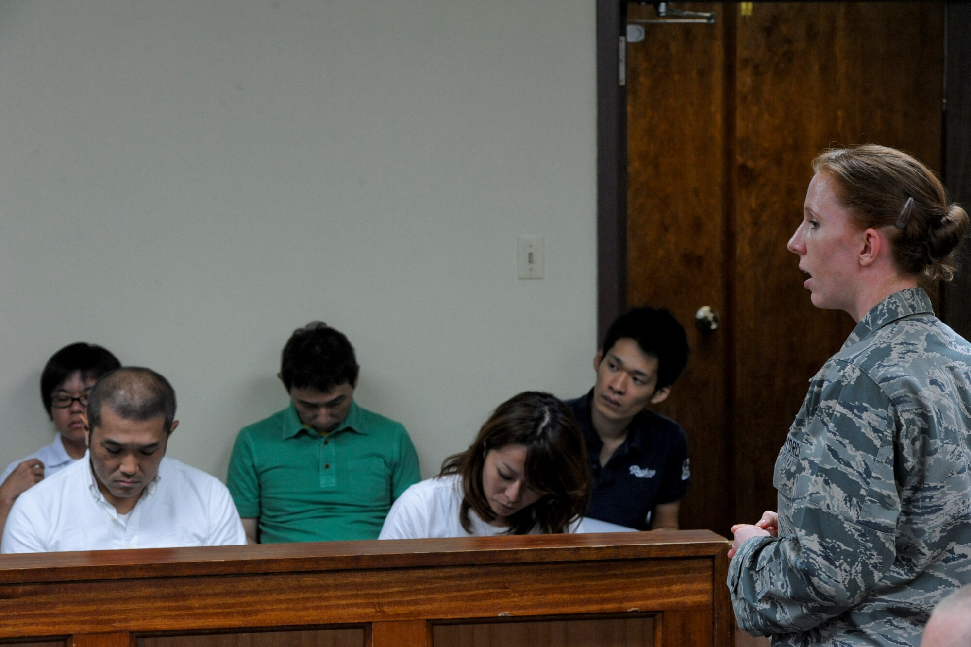 U.S. Air Force Capt. Michelle Clark, 18th Wing Judge Advocate chief of military justice, briefs  students from the University of Ryukyu's Graduate School of Law during their visit to Kadena Air Base, Japan, Sept. 27, 2012. The law students came to Kadena in an effort to learn more about the  military court system. (U.S. Air Force photo/Airman 1st Class Justin Veazie)
