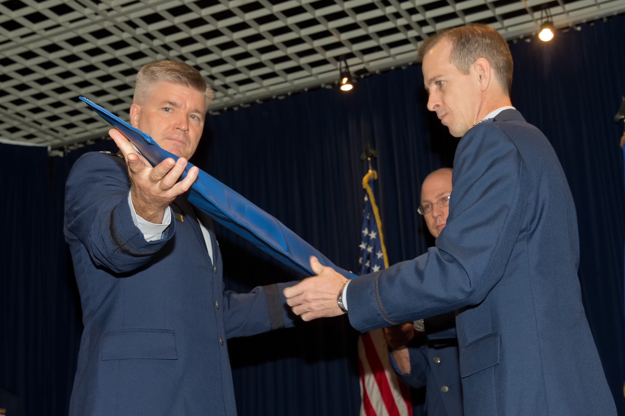 YOKOTA AIR BASE, Japan -- U.S. Air Force Brig. Gen. Jerry Harris Jr. (left), 5th Air Force vice commander, and U.S. Air Force Col. Marc Reese (right), 13th Air Force Detachment 1 commander, furls the guidon during its inactivation ceremony at Yokota Air Base, Japan, Sept. 26, 2012.  The consolidation of Det 1 personnel into 5th Air Force is expected to streamline cooperation between 5th Air Force and the Japan Self Defense Forces, ultimately leading to increased interoperability and efficiency. (U.S. Air Force photo by Osakabe Yasuo)  
