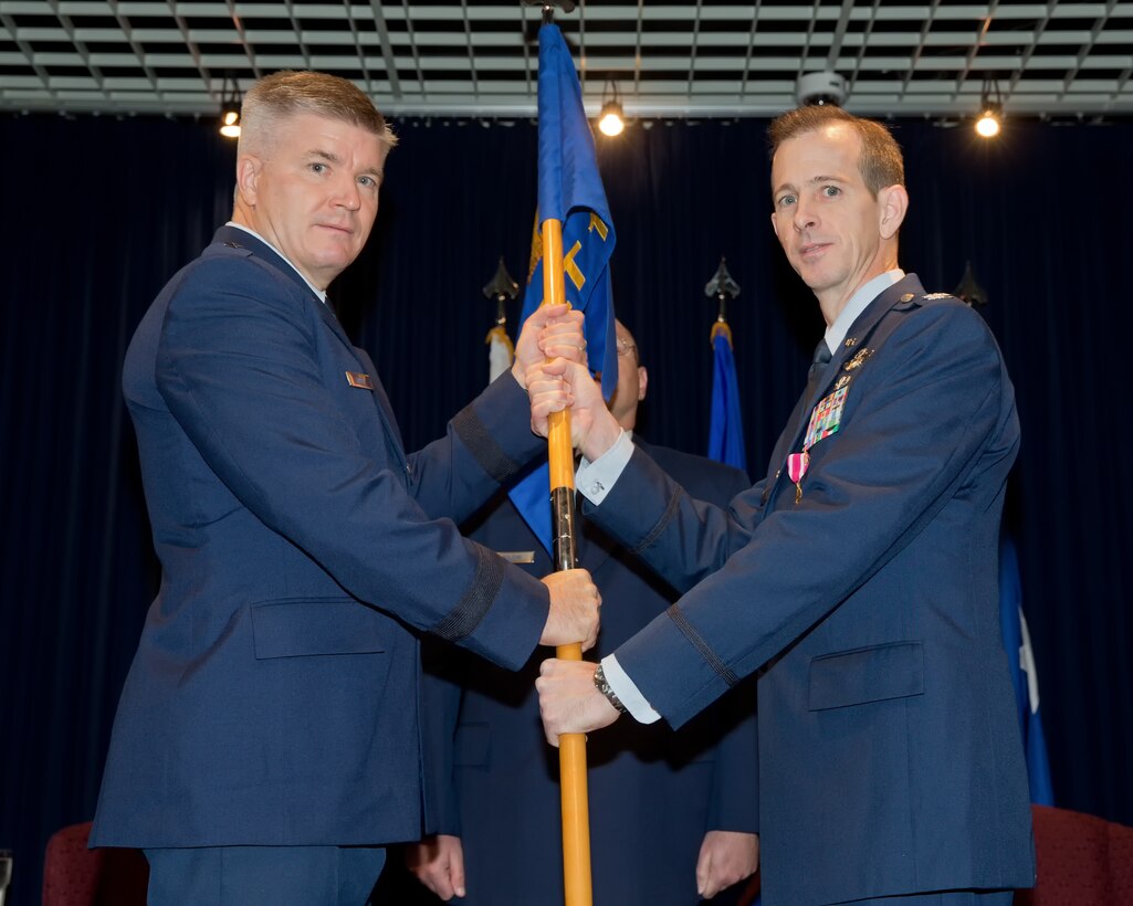 YOKOTA AIR BASE, Japan -- U.S. Air Force Brig. Gen. Jerry Harris Jr. (left), 5th Air Force vice commander, receives the guidon from U.S. Air Force Col. Marc Reese, 13th Air Force Detachment 1 commander, during the 13th AF Det 1 inactivation ceremony at Yokota Air Base, Japan, Sept. 26, 2012.  All of the Det 1 personnel are now part of 5th Air Force, resulting in no loss in commitment or capability in the Pacific. (U.S. Air Force photo by Osakabe Yasuo)