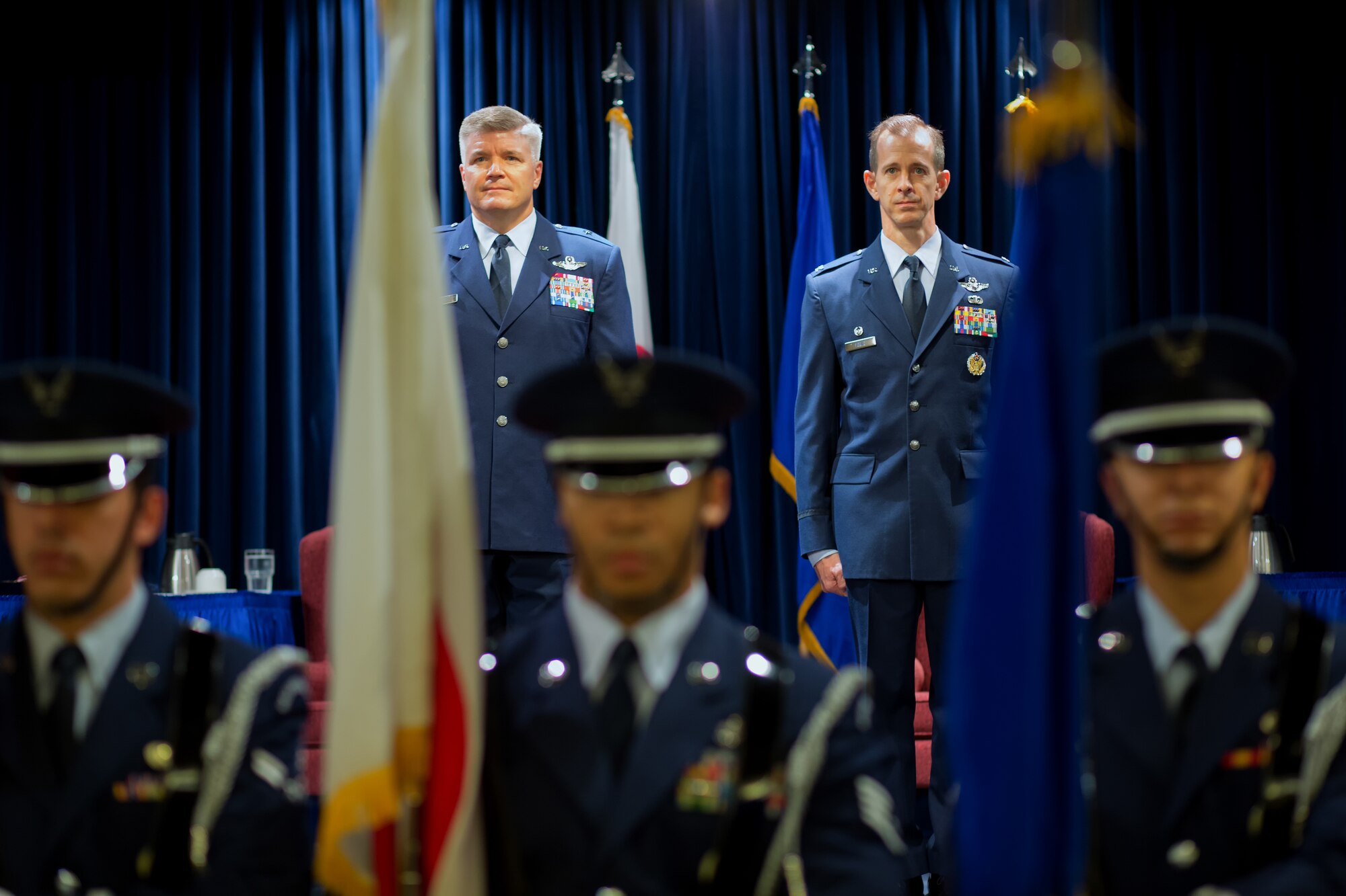YOKOTA AIR BASE, Japan -- U.S. Air Force Brig. Gen. Jerry Harris Jr. (left), 5th Air Force vice commander, and U.S. Air Force Col. Marc Reese, 13th Air Force Detachment 1 commander, stand at attention while the Yokota Honor Guard presents "The Colors" during the 13th AF Det 1 inactivation ceremony at Yokota Air Base, Japan, Sept. 26, 2012. The consolidation of Det 1 personnel into 5th Air Force is expected to streamline cooperation between 5th Air Force and the Japan Self Defense Forces, ultimately leading to increased interoperability and efficiency. (U.S. Air Force photo by Osakabe Yasuo)