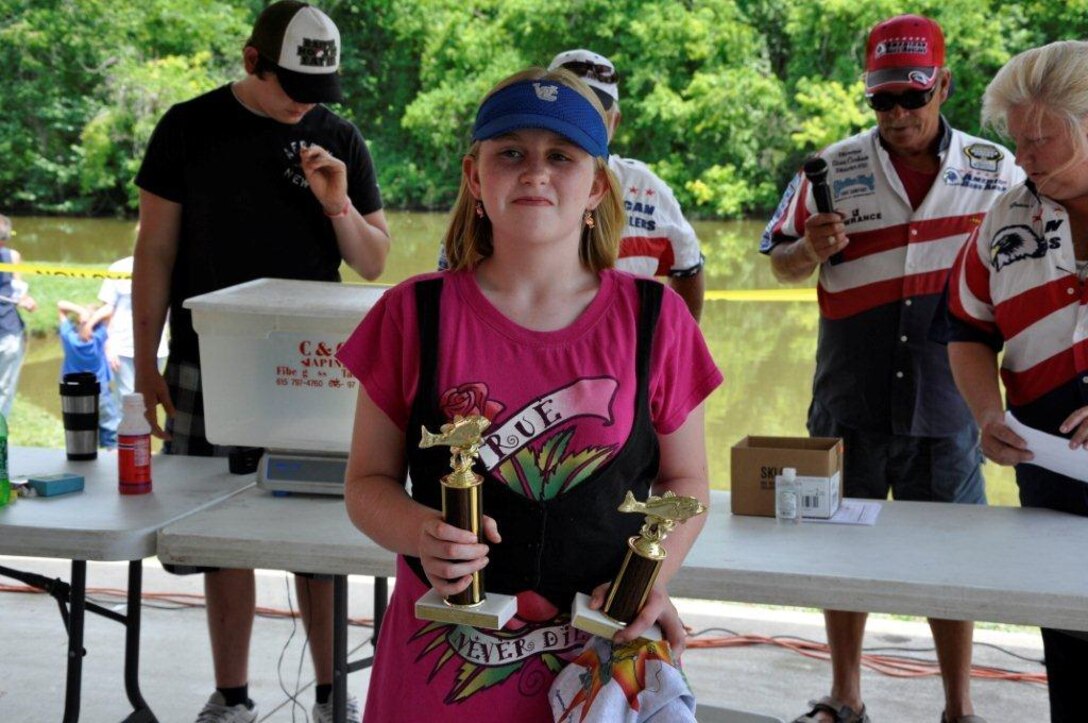 Patricia Worthington, 12, received two trophies; one for largest fish at 4.95 pounds, and she placed second in total weight with 9.25 pounds of fish caught in the 11-15 age group at the Cheatham Lake Fish Bustin’ Rodeo June 9, 2012. (USACE photo by Fred Tucker)