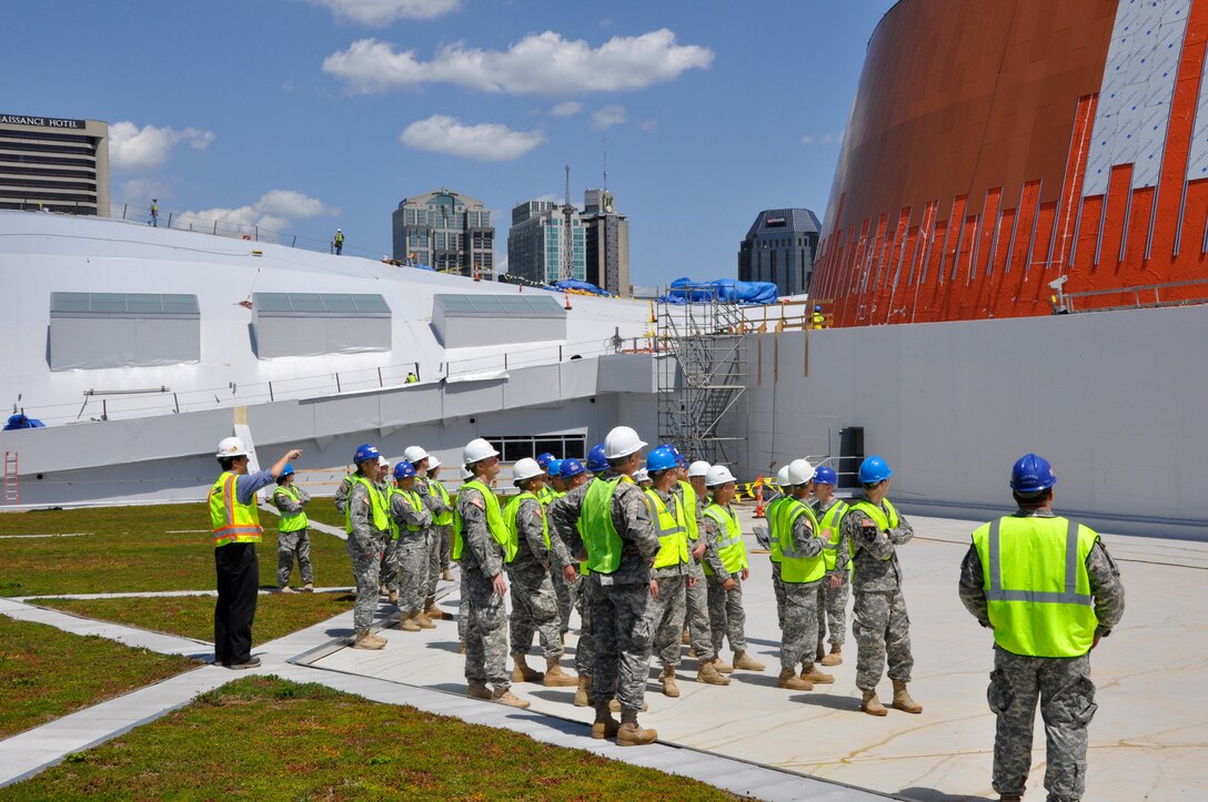 Combat engineers of Fort Campbell’s 326th Engineer Battalion, 101st Airborne Division, are briefed atop Music City Center during a tour of the construction site May 9, 2012 while visiting the U.S. Army Corps of Engineers Nashville District. (USACE photo by Fred Tucker)