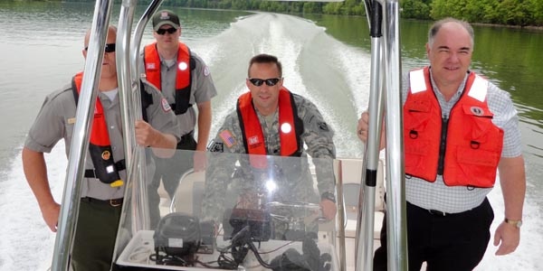 Lt. Col. James A. DeLapp, U.S. Army Corps of Engineers Nashville District, inspects Cordell Hull Lake with several Park Rangers April 13, 2012. (USACE photo by Joanne Mann)