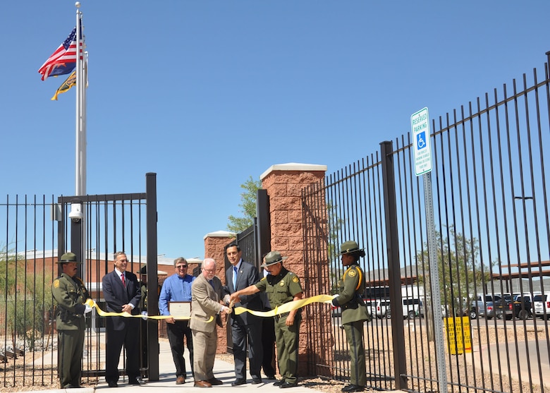 Rep. Darrell Issa (center) cuts the ribbon to symbolically open the Brian A. Terry Border Patrol Station in Bisbee, Ariz., following a dedication ceremony Sept. 18. The U.S. Army Corps of Engineers Los Angeles District constructed the station which was named for the Border Patrol agent killed in the line of duty Dec. 15, 2010. 