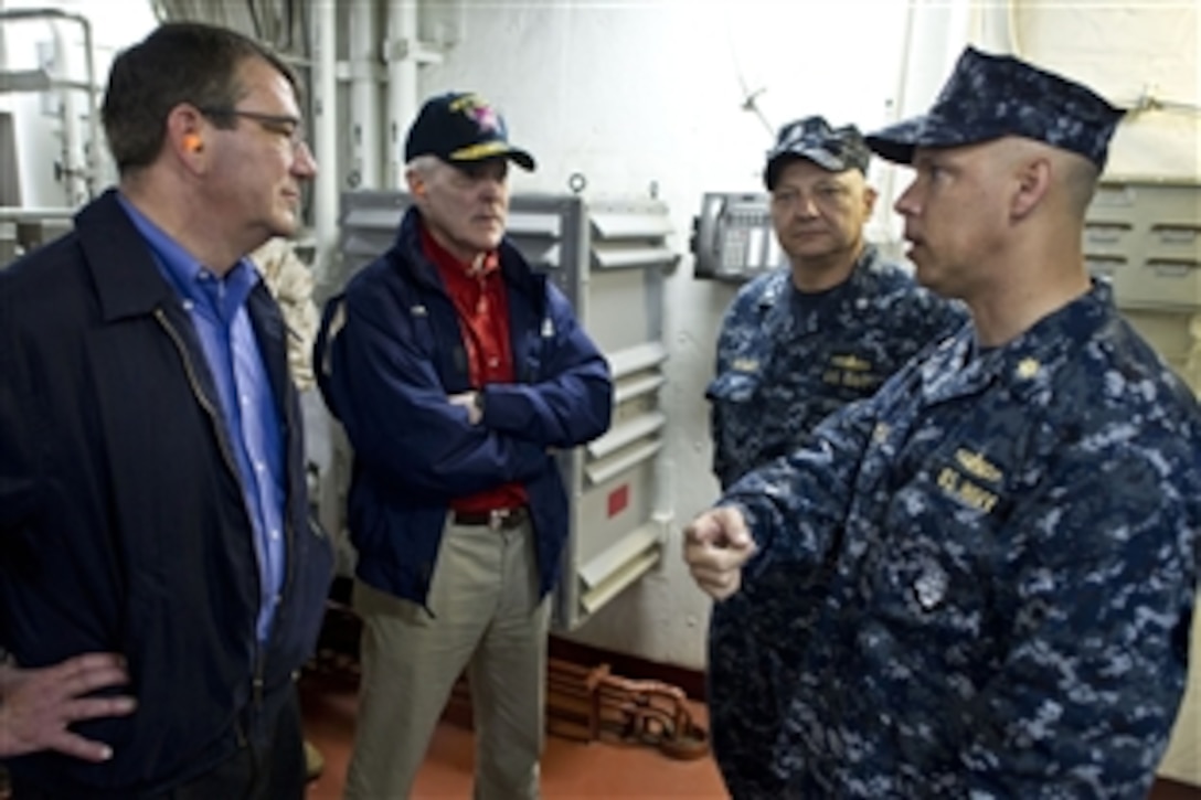 Deputy Defense Secretary Ashton B. Carter, left, and Navy Secretary Ray Mabus, second from left, speak with Navy Lt. Cmdr. Brian Ponce and Navy Cmdr. Barry Barrows during a visit to the USS Makin Island, Sept. 27, 2012.