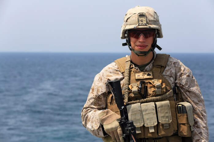 USS GUNSTON HALL, Gulf of Aden (Sept. 20. 2012) - Cpl. Adrian Cuevas, a machine gun squad leader for Charlie Company, Battalion Landing Team 1st Battalion, 2nd Marine Regiment, 24th Marine Expeditionary Unit, poses for a photograph, Sept. 20, 2012, on the flight deck of the USS Gunston Hall in the Gulf of Aden. The 24th MEU is deployed with the Iwo Jima Amphibious Ready Group as a theater reserve force for U.S. Central Command and is providing support for maritime security operations and theater security cooperation efforts in the U.S. Navy's 5th Fleet area of responsibility. (Official Marine Corps photo by Sgt. Richard Blumenstein) 