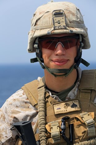 USS GUNSTON HALL, Gulf of Aden (Sept. 20. 2012) - Cpl. Adrian Cuevas, a machine gun squad leader for Charlie Company, Battalion Landing Team 1st Battalion, 2nd Marine Regiment, 24th Marine Expeditionary Unit, poses for a photograph, Sept. 20, 2012, on the flight deck of the USS Gunston Hall in the Gulf of Aden. The 24th MEU is deployed with the Iwo Jima Amphibious Ready Group as a theater reserve force for U.S. Central Command and is providing support for maritime security operations and theater security cooperation efforts in the U.S. Navy's 5th Fleet area of responsibility. (Official Marine Corps photo by Sgt. Richard Blumenstein) 