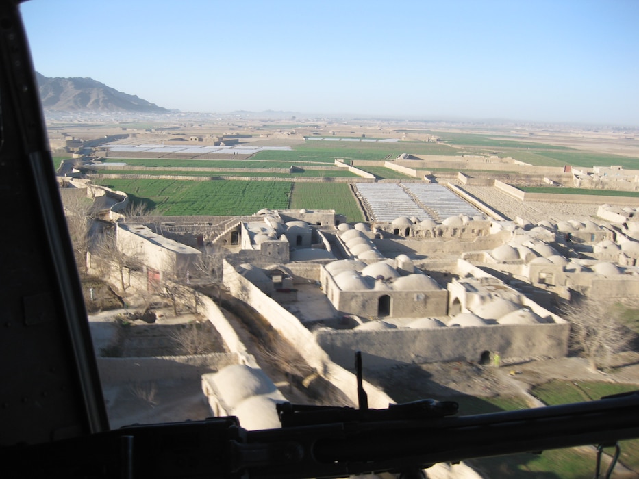 Maj Brown flying over Farah Province in Mar 2009. During an IA deployment with SPMAGTF-A and RCT-3, his FAO background made him a more effective MAGTF officer as LNO to HQ RC-West in Heart as the voice of the USMC on an Italian and Spanish staff in Afghanistan