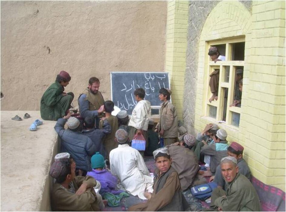 Marine FAO LtCol Carroll teaching Afghan students in Now Zad