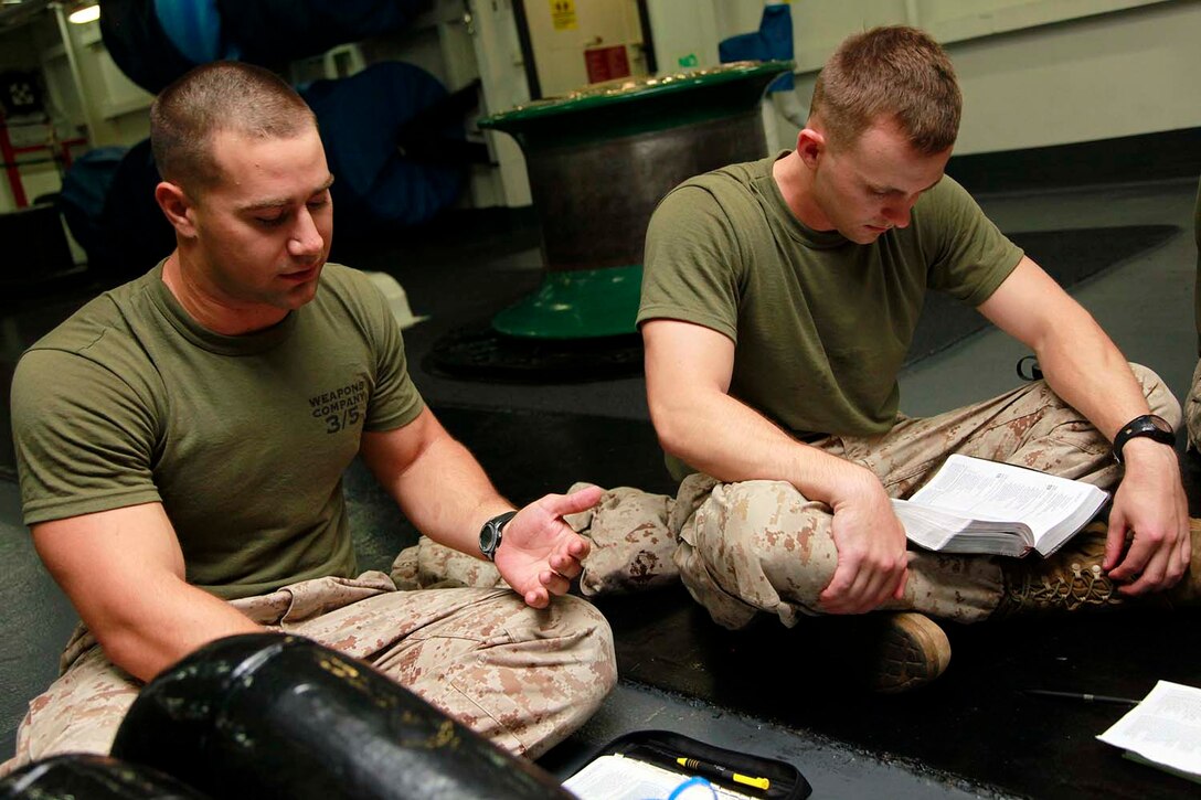 Sergeant Scott W. Gilchrist, Tactical Recovery of Aircraft and Personnel team leader, 81mm Mortar/TRAP Platoon, Weapons Company, Battalion Landing Team 3/5, 15th Marine Expeditionary Unit, discusses his view on a scripture he read in the bible during a bible study aboard the USS Peleliu, Sept. 27. Marines with BLT 3/5, 15th MEU have recently formed Darkhorse Disciples, a lay-led bible study, aboard the USS Peleliu. While infantry Marines founded the program, servicemembers of any rank or field are welcome to attend. Gilchrist, 24, is from Ft. Worth, Texas.