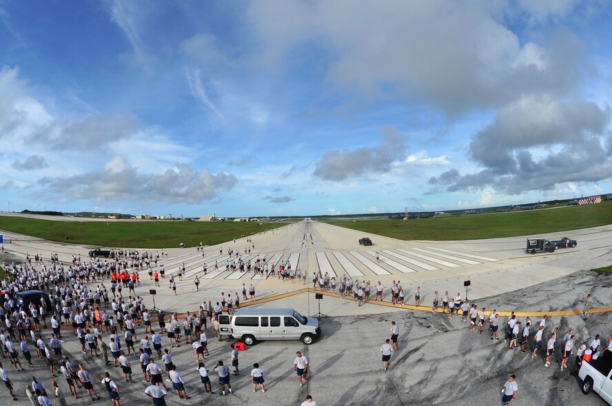 ANDERSEN AIR FORCE BASE, Guam –Members of Team Andersen and their families participate in the monthly wing run here, Sept. 28. This month’s wing run was approximately 3.5 miles and was followed by a foreign object debris walk on the flightline. These events are held to emphasize physical fitness and esprit de corps throughout the Team Andersen community.  (U.S. Air Force photo by Staff Sgt. Alexandre Montes)