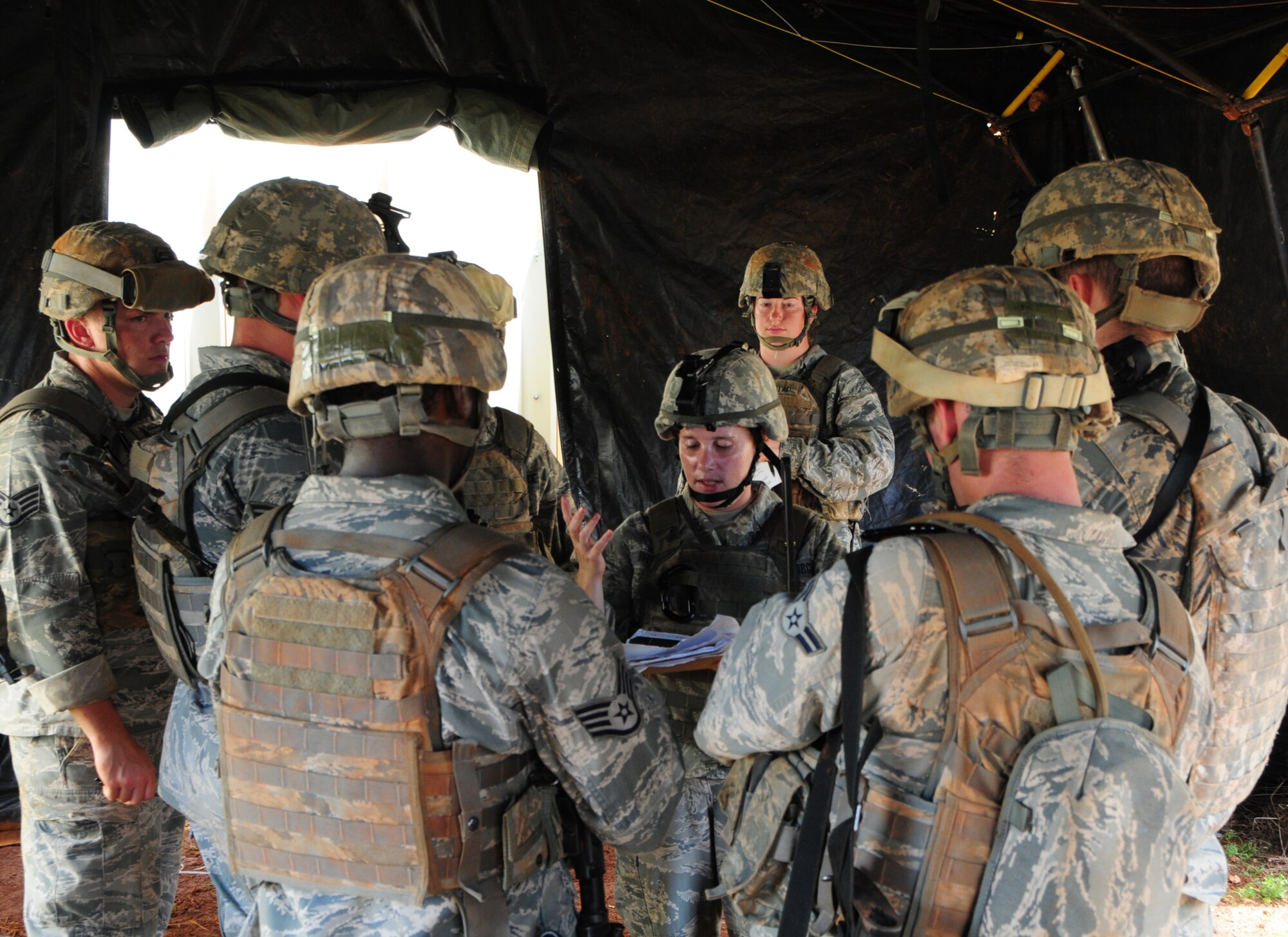 PACIFIC REGIONAL TRAINING CENTER, Guam – Commando Warrior students from Kadena Air Force Base, Japan, discuss the mission and plan of action before going out on patrol here, Sept. 24. Security forces Airmen from all over the Pacific travel to Guam in order to receive mandatory contingency training from the 736th Security Forces Squadron Commando Warrior flight in preparation for future deployments downrange. (U.S. Air Force photo by Airman 1st Class Marianique Santos/Released)