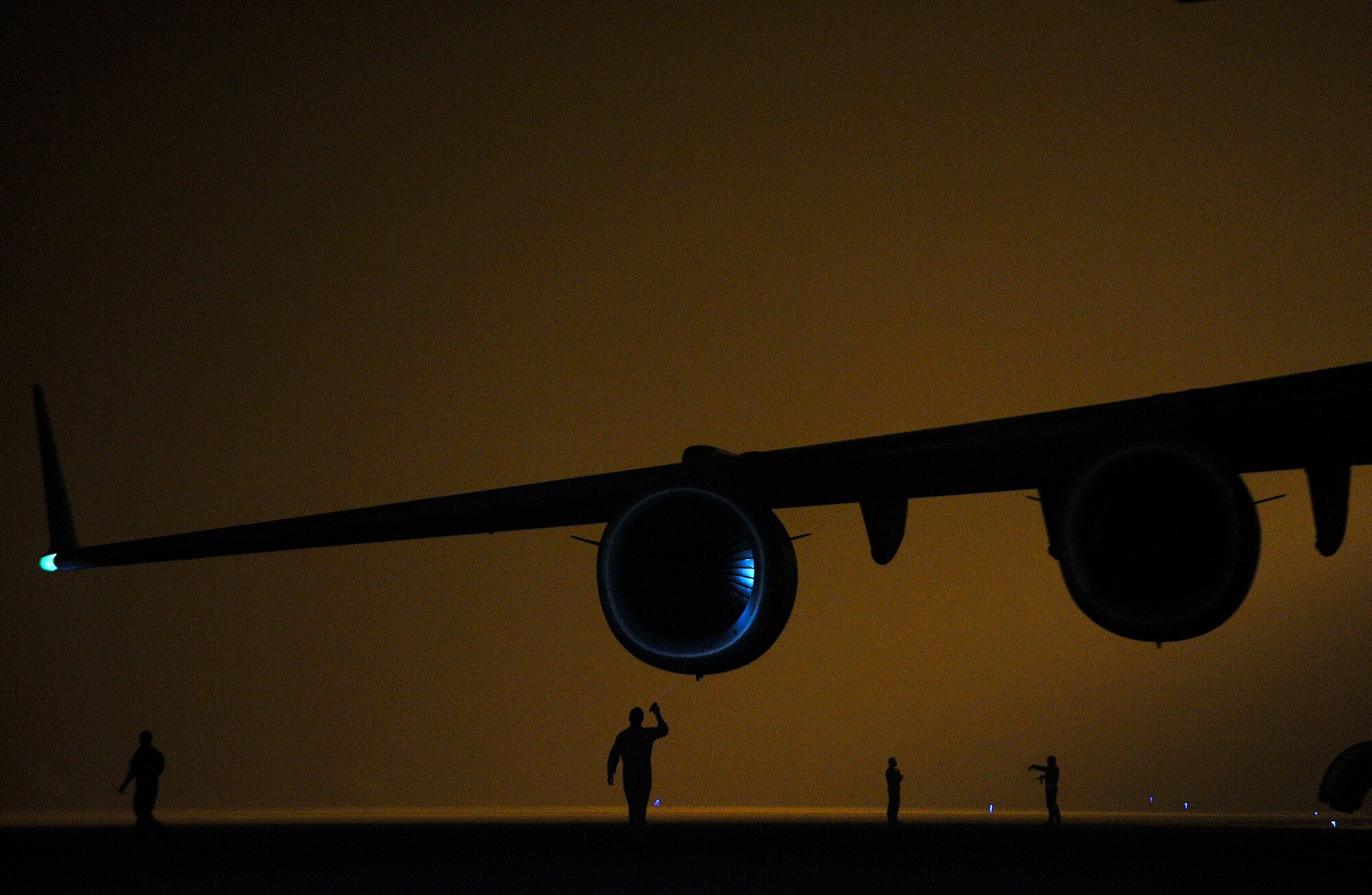 U.S. Air Force C-17 Globemaster III aircrew members conduct pre-flight procedures during a redeployment mission at Camp Bastion, Afghanistan, Sept. 12, 2012. The C-17, with its expansive airlift and transport capabilities, play a major role in the redeployment operations of U.S. military forcest. Redeployment is the result of the success of the transition process and the return of control of territory to the Afghan people. Redeployment is the natural outcome of successful transition to an Afghan lead for security.

 (U.S. Air Force photo/Staff Sgt. Clay Lancaster)