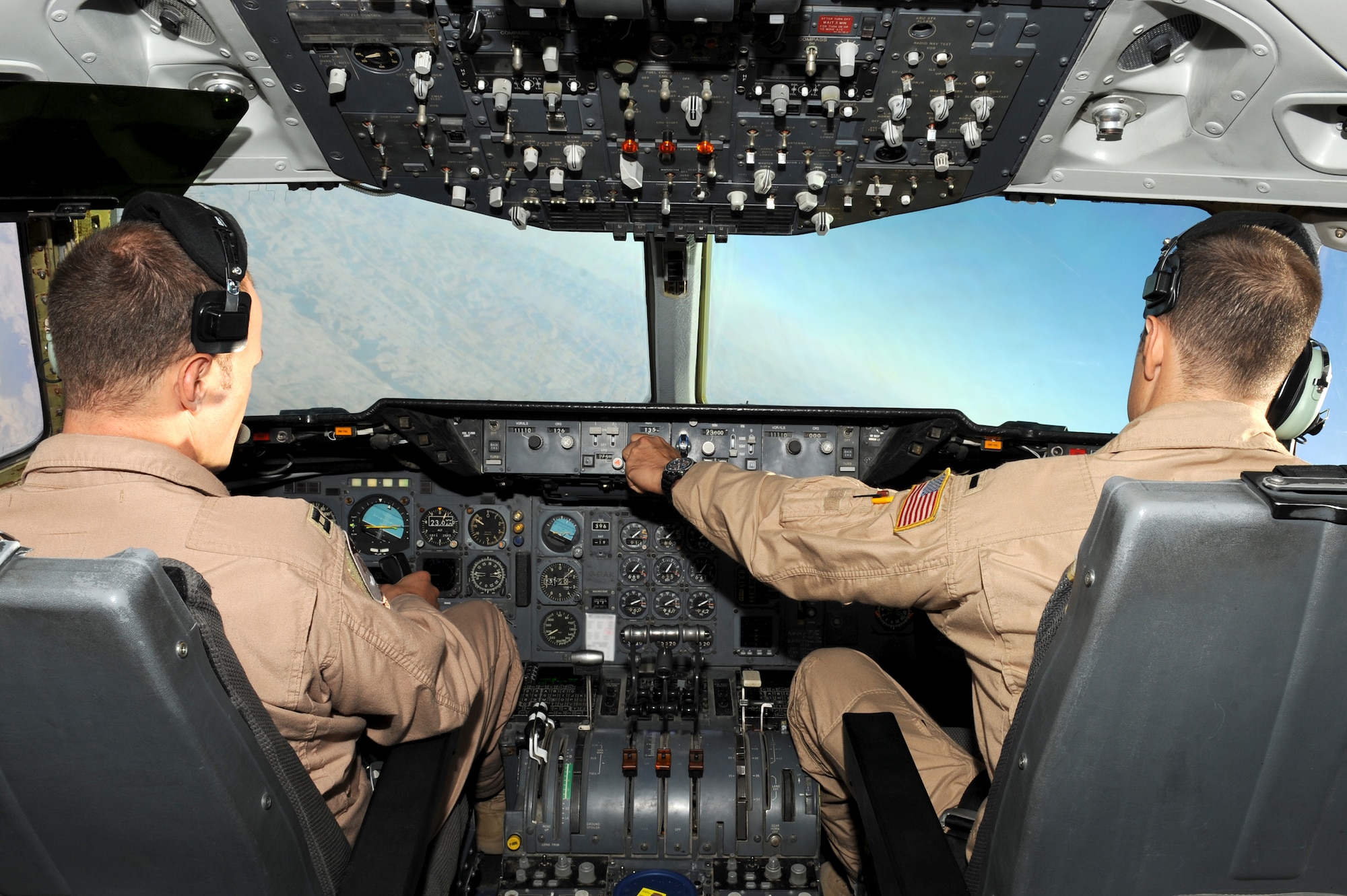 SOUTHWEST ASIA - U.S. Air Force Capt. Vincent Wright, aircraft commander, left, and 1st Lt. Kurt Rommel, co-pilot, right, fly a KC-10 Extender during refueling operations Sept. 18, 2012. Wright and Rommel are deployed to the 380th Air Expeditionary Wing as part of the 908th Expeditionary Aerial Refueling Squadron. (U.S. Air Force photo/Master Sgt. Scott MacKay)