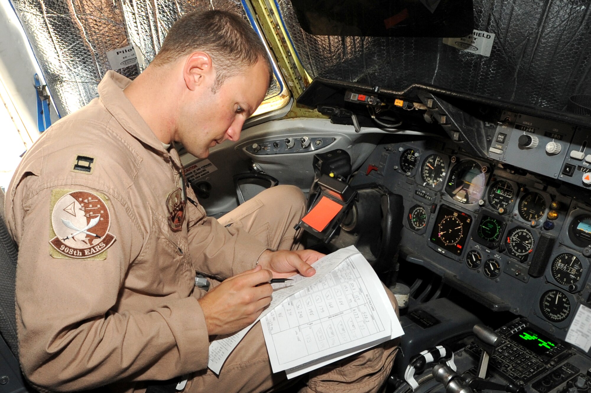 SOUTHWEST ASIA - U.S. Air Force Capt. Vincent Wright, 908th Expeditionary Aerial Refueling Squadron aircraft commander, completes pre-flight paperwork before his mission Sept. 18, 2012. Wright pilots KC-10 Extenders for the 380th Air Expeditionary Wing. (U.S. Air Force photo/Master Sgt. Scott MacKay)
