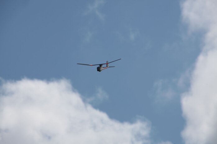 A Raven unmanned aerial vehicle flies through the sky over Camp Lejeune, N.C., during a training exercise held by Marines from Combat Logistics Battalion 6, 2nd Marine Logistics Group March 26, 2013. Raven UAVs can be used day or night to relay photos. (U.S. Marine Corps photo by Lance Cpl. Shawn Valosin)