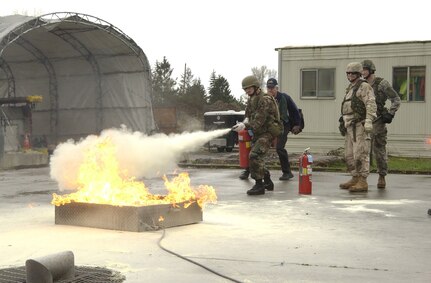 Oregon Army National Guard Sgt. Thomas Pettit of Goldendale, Wash. extinguishes a surface fire at the Tualatin Valley Fire and Rescue Training Center in Sherwood Mar. 10. Sixty soldiers of Oregon's 141st Brigade Support Battalion received hands-on training in live fire, vehicle extrication, and urban search and rescue exercises. In addition, the TVF&R trainers taught courses on CPR/First Aid and incident command systems. Training such as this between the Oregon National Guard and first responders enhances the Guard's ability to support local communities when disasters strike.