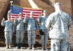 (From left) Staff Sgt. Melissa Meger, Sgt. Michael Sayre and Sgts. 1st Class David Drazek and Joseph Schwinghammer, 1st Brigade Combat Team, 34th Infantry Division, recite the oath of reenlistment at the steps of the Ziggurat of Ur. 