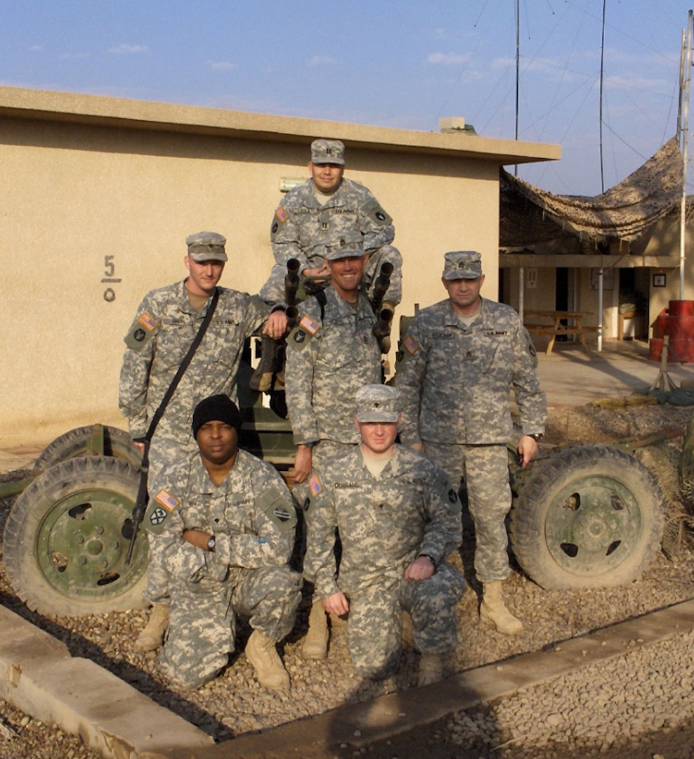 Minnesota National Guard Soldiers of the Camp Taji sheriff station. Front row, Spc. Joseph Wilson, Spc. Joseph Derrane. Second row, Spc. Christopher Smith, Master Sgt. Paul Hoppe, Staff Sgt. Karl Stocker. Third row, Capt. Edward Vela.