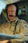 Senior Master Sgt. Robert Lundy from the 172nd Airlift Wing, Mississippi Air National Guard monitors a loadmaster station on March 4 aboard a C-17 Globemaster III bound for Ramstein Air Base, Germany.