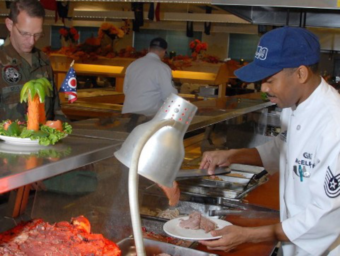 Tech. Sgt. Derrick McElrath serves lunch during the Disney competition. 