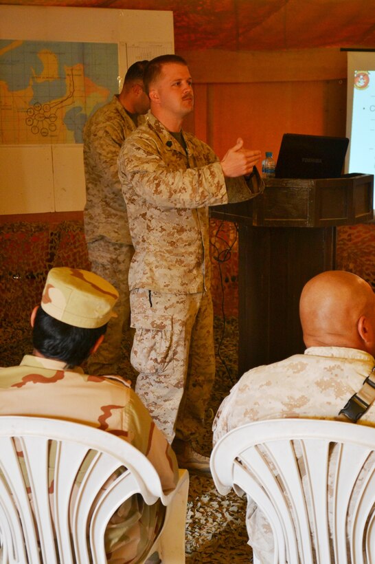 Gunnery Sgt. Andrew J. Hodges, foreign area staff non-commissioned officer, 15th Marine Expeditionary Unit (MEU), translates a combat operations center brief for members of the Royal Saudi Naval Force, Jan. 6. The 15th MEU is deployed as part of the Peleliu Amphibious Ready Group as a U.S. Central Command theater reserve force, providing support for maritime security operations and theater security cooperation efforts in the U.S. 5th Fleet area of responsibility. (U.S. Marine Corps photo by 2nd Lt. Matthew W. Finnerty/Released)