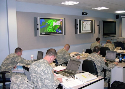 Members of the Joint Force HQ-NY Joint Operations Center in Latham, N.Y. conduct planning and coordination for the New York National Guard response to the mid-April Nor'Easter that struck the northeast on April 15, 2007. The New York National Guard provided more than 900 Soldiers across New York City, LI and Westchester in support of the State Emergency Management Office. Missions and support through April 16 include positioning equipment, sandbags and civilian evacuations as New York confronts the unexpected winter storm.