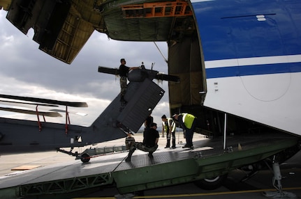 129th Rescue Wing personnel load a HH-60G Pave Hawk rescue helicopter on to a Russian Volga-Dnepr AN-124 long-range heavy transport aircraft at Moffett Federal Airfield, Calif. April 20, 2007. The AN-124 transported 129th Rescue Wing deployment cargo to Afghanistan. 