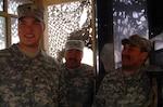 Sgt. Jonathan Weyiouana (center) and Sgt. 1st Class Floyd Ticket (right) visit with Spc. Joshua Degeus in a guard tower at a camp near the Kuwait-Iraq border. Ticket and Weyiouana were making the rounds, visiting Soldiers on guard duty. The Soldiers are members of Alaska Army National Guard's Alpha Company, 3rd Battalion, 297th Infantry, and all are from Alaska. Weyiouana, Ticket and Degeus are from respectively, Shishmaref, Buckland and Wasilla.