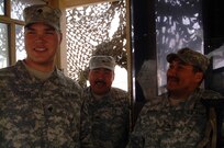 Sgt. Jonathan Weyiouana (center) and Sgt. 1st Class Floyd Ticket (right) visit with Spc. Joshua Degeus in a guard tower at a camp near the Kuwait-Iraq border. Ticket and Weyiouana were making the rounds, visiting Soldiers on guard duty. The Soldiers are members of Alaska Army National Guard's Alpha Company, 3rd Battalion, 297th Infantry, and all are from Alaska. Weyiouana, Ticket and Degeus are from respectively, Shishmaref, Buckland and Wasilla.