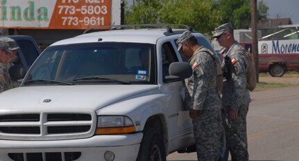 Texas National Guard soldiers assist the Department of public safety with security operations after a tornado destroyed parts of Eagle Pass, Texas.