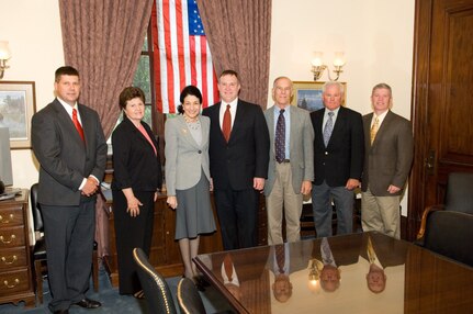 Representatives from the Maine Air National Guard's 101st Air Refueling Wing meet with Maine Sen. Olympia Snowe in Washington. The wing, based at Bangor International Airport, was awarded the 2006 Air Force General Thomas D. White Environmental Quality Award.