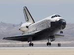 Space Shuttle Atlantis lands at Edwards Air Force Base, Calif., on June 22 to complete a 14-day mission to the International Space Station. The Air National Guard was ready to help in case of an emergency during the June 8 launch.