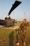 Chief Warrant Officer Brian Michael, a pilot with Company B, 1st Battalion, 137th Aviation Regiment prepares the UH-1H Iroquois for one of its last missions with the Ohio Army National Guard. Michael flew the Iroquois, more commonly known as the Huey during the Vietnam War.
