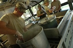 Akron, Ohio resident Pfc. Marshall Conyers, food service specialist, prepares French onion soup, June 16 as he and other Soldiers of the 1485th Transportation Company, 112th Transportation Battalion compete in highly prestigious Connelley competition.