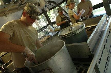 Akron, Ohio resident Pfc. Marshall Conyers, food service specialist, prepares French onion soup, June 16 as he and other Soldiers of the 1485th Transportation Company, 112th Transportation Battalion compete in highly prestigious Connelley competition.