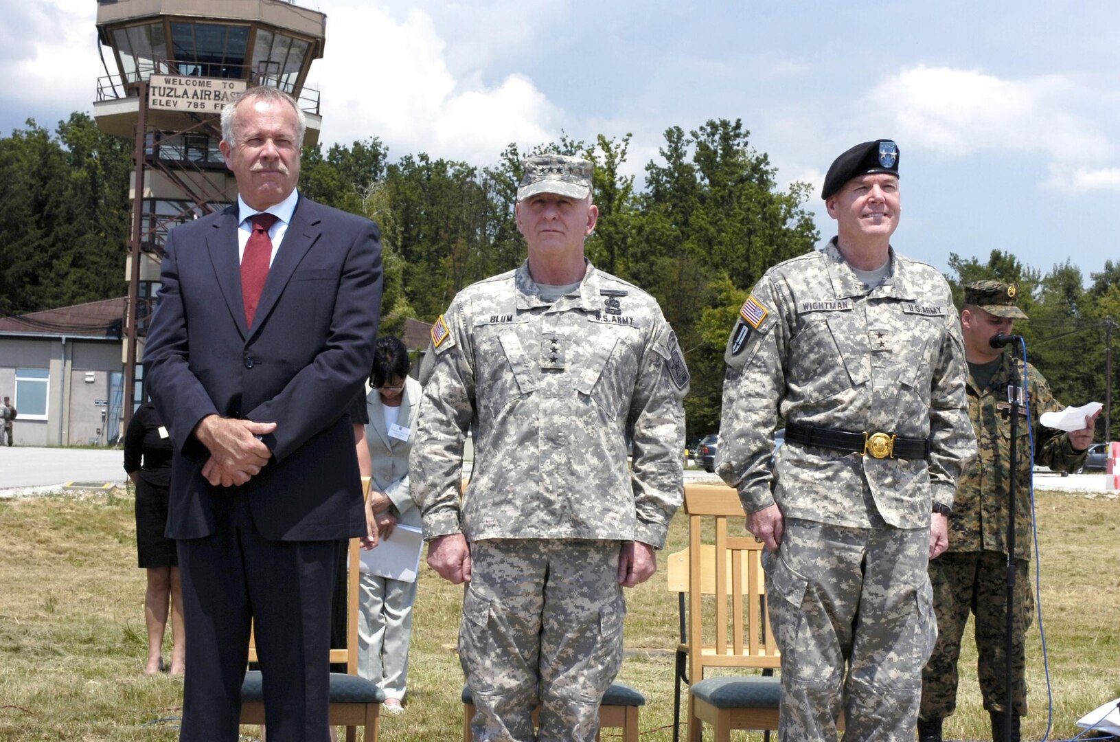 U.S. Ambassador Douglas L. McElhaney; LTG H Steven Blum, the chief of the National Guard Bureau; and Maj. Gen. Richard Wightman Jr., senior military representative at NATO Headquarters in Bosnia and Herzegovina honor arriving officials from Bosnia-Herzegovina during ceremonies marking the turnover of Eagle Base, near Tuzla, in Bosnia-Herzegovina, from the United States to the government of Bosnia-Herzegovina on June 30, 2007. More than 100,000 members of the active duty and Reserve components of the U.S. military have served at Eagle Base since it opened 12 years ago.
