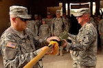 Command Sgt. Maj. Brian Sann, left, brigade sergeant major for the 58th Brigade Combat Team, left, and Col. Sean Casey, commander of the 58th BCT, uncase the unit's colors during a transfer of authority ceremony in which the 58th BCT assumed responsibility for garrison operations of Victory Base Complex, Iraq, from the 38th Division Support Command, Tuesday, July 10, 2007. The 58th BCT will be responsible for all daily operations on VBC.(U.S. Army photo by Staff Sgt. Jon Soucy) (Released)