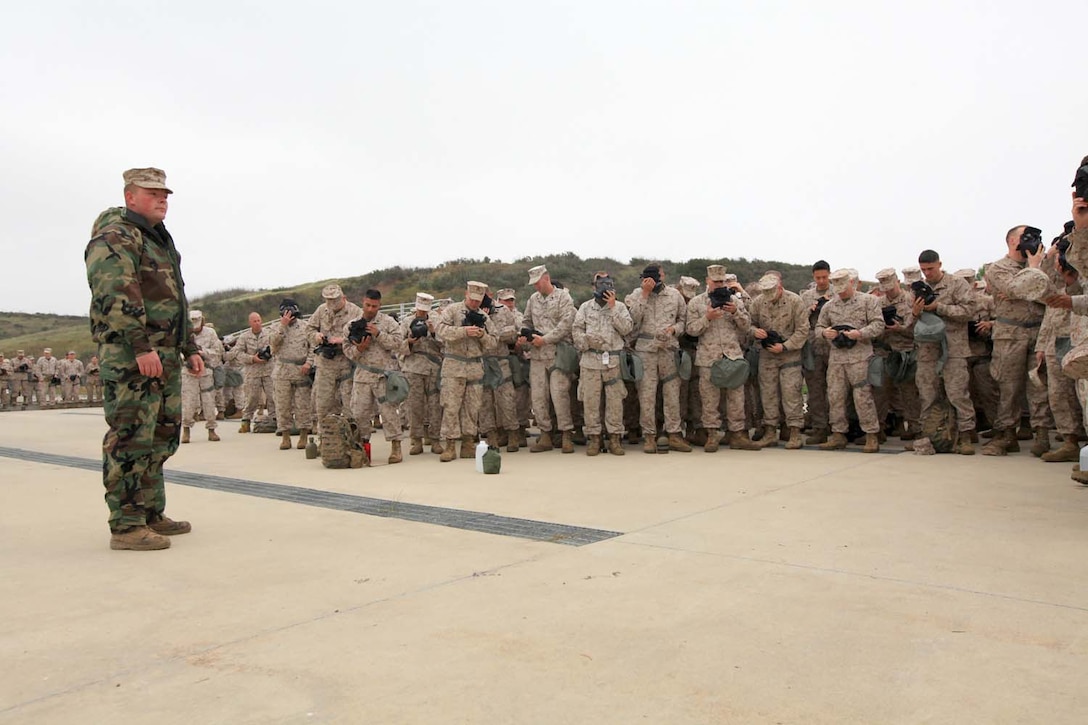 Cpl. Ronald Isaacs, 24, from Bluff City, Tenn., a chemical, biological, radiological, nuclear defense chief with 9th Communication Battalion, I Marine Expeditionary Force, instructs a group of Marines prior to entering a gas chamber at Camp Pendleton, Calif., March 26. The annual gas chamber training provides Marines with a basic knowledge of how to don and clear a gas mask to effectively defend against chemical or biological assaults.