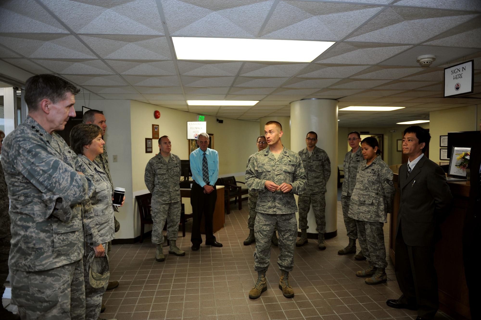 U.S. Air Force Capt. Konrad Osa, Kadena Legal Office chief of operations and international law, introduces members of the legal office to Lt. Gen. Richard Harding, The Judge Advocate General (TJAG), during a visit to Kadena Air Base, Japan, March 29, 2013. Harding visited the law center as part of an inspection, ensuring the legal staff is in compliance with regulations. (U.S. Air Force photo/Airman 1st Class Hailey R. Davis)