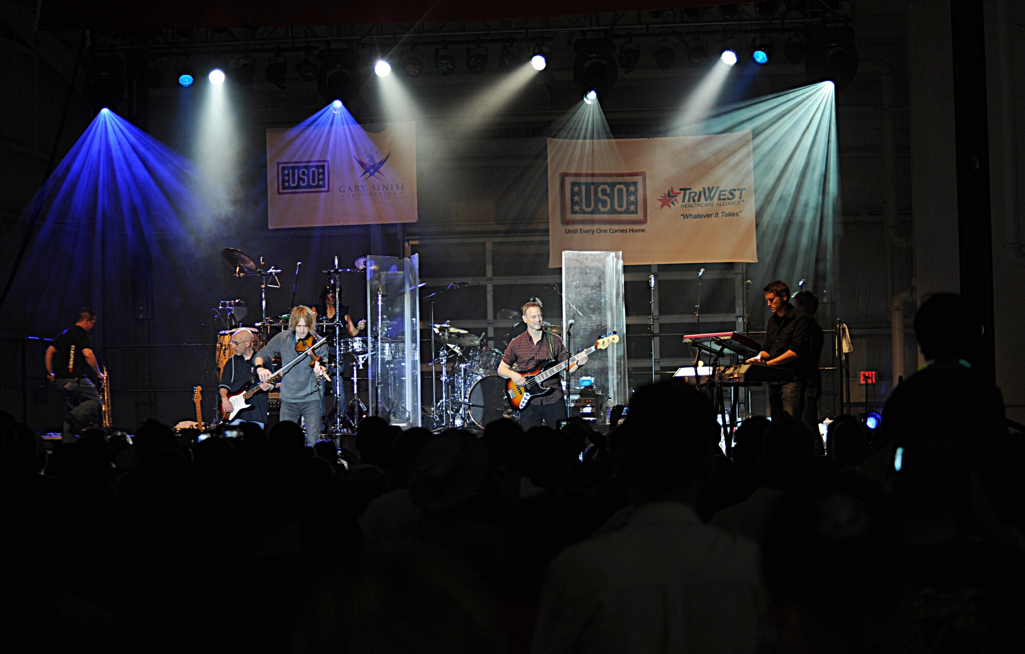 The Lt. Dan Band performs a song during a free USO show at Davis-Monthan Air Force Base, Ariz., March 29, 2013. The band covered several songs from past and current artists. (U.S. Air Force photo by Senior Airman Timothy Moore/Relased)